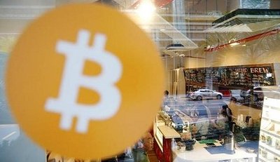 A large-scale Bitcoin mining farm with rows of mining rigs.